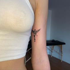 a woman with a small tattoo on her arm