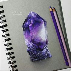 a drawing of a purple crystal next to a pencil