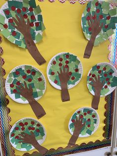 paper plates with trees cut out of them