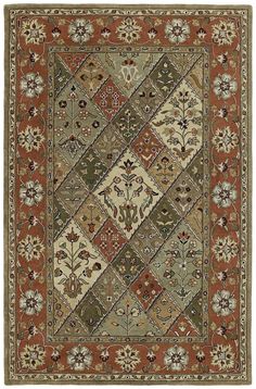 an area rug with many different colors and designs on the carpet, including red, green,