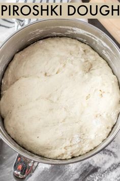 a metal pan filled with dough next to a rolling pin