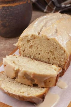 sliced loaf of banana bread sitting on top of a cutting board