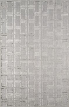 an area rug with squares and lines in grey tones on a white background, it looks like the fabric has been woven over