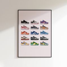 a framed poster with different shoes on it in a room next to a white wall