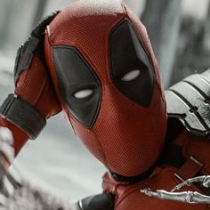 the deadpool character is wearing red and black