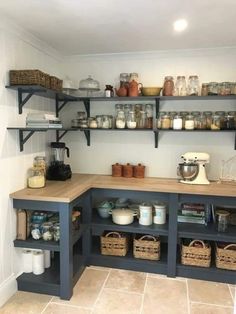 a kitchen with shelves filled with jars and containers