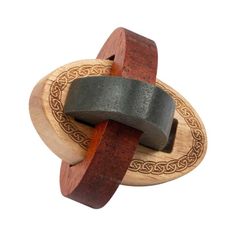 a wooden ring with an intricate design on it