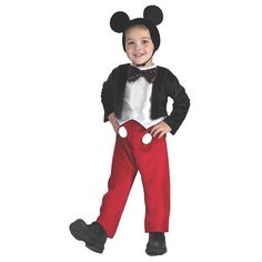 a young boy dressed in mickey mouse costume