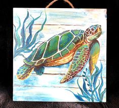 a painting of a sea turtle swimming in the ocean