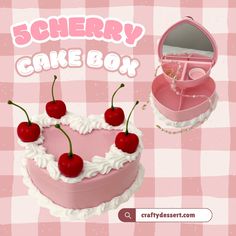 there is a cake with cherries on it and the box has a mirror in it