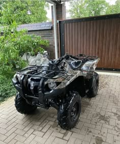 an atv is parked in front of a house