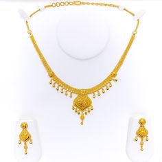 Weighing 34.1 grams of 22k yellow gold, this captivating tasseled heirloom necklace set exudes timeless elegance and luxury. The necklace, with a length of 16 inches and a 1.75-inch drop, showcases a beautiful tasseled design that adds movement and sophistication. The adjustable 1.75-inch links and hook lock provide flexibility and a secure fit. The set includes matching earrings, each measuring 1.75 inches, with secure screw-back posts for comfort and stability. Perfect for special occasions or Pinterest Wishlist, 22k Gold Necklace Set, Heirloom Necklace, 22k Gold Necklace, Bridal Jewelry Necklace, Precious Stones Rings, Diamond Pendant Sets, Modern Bracelets, Fancy Necklace