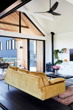 a living room filled with furniture and a flat screen tv