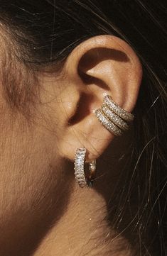 Pavé cubic zirconia twinkle along a glamorous ear cuff plated in high-shine 14-karat gold. Sold as a single earring 5/8" diameter; 1/8" width 14k-gold plate/cubic zirconia Made in the USA Luxury Yellow Gold Minimalist Ear Cuff, Pave Ear Cuff, Minimalist Ear Cuff, Earrings Stand, Child Of Wild, Inner Ear, Gold Ear Cuff, Earring Stand, Silver Ear Cuff