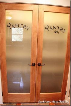 two glass doors with writing on them that say vanity and vanity next to each other