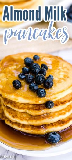 blueberry pancakes stacked on top of each other with the words, almond milk pancakes