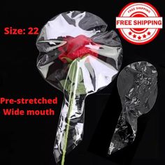 the package is wrapped in plastic and has a red rose on it, as well as a free shipping stick