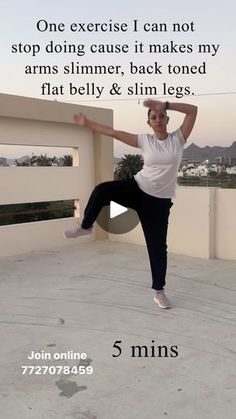 a woman is doing an exercise on the roof with her feet in the air and one leg up