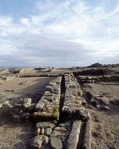 an old stone wall in the middle of nowhere