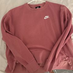 Crew Neck Brand Nike, Very Cute And Simple In Brand New Quality Besides A Little Mark On The Front But It Is Barely Noticeable Nike Casual Sweats For Fall, Casual Nike Sweats, Comfy Pink Crew Neck Sweatshirt, Nike Crew Neck Hoodie For Spring, Pink Nike Hoodie With Crew Neck, Nike Casual Sweats For Spring, Casual Nike Sweats For Spring, Comfy Pink Top With Ribbed Cuffs, Comfortable Pink Top With Ribbed Cuffs