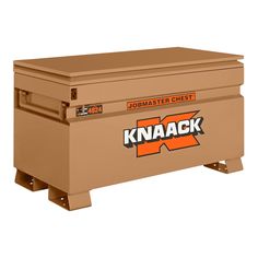 a large brown box sitting on top of a white background with the words knaack printed on it