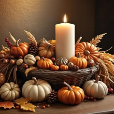 a candle sits on top of a basket filled with pumpkins and gourds