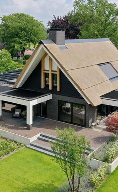 an aerial view of a modern house in the countryside