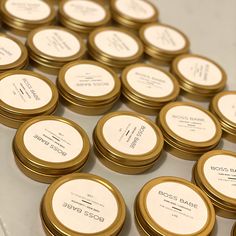 rows of gold and white round business cards