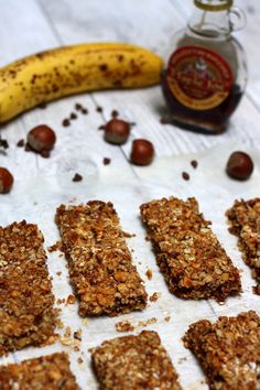 some granola bars and a banana on a table