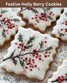 cookies decorated with holly and red berries are on a doily for the festive holly berry cookies