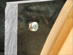 a glass door with the reflection of an object in it's window sill