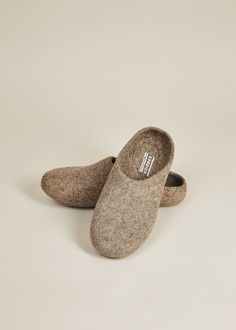 • If you are between sizes, we suggest sizing up• Felted wool slippers• Grippy, sustainable silicone indoor sole• Hassel-free low back for easy slipping on and off• Handmade in Kyrgyzstan For a more narrow fit, we suggest this style. Also available in women's sizes. Kyrgies Classics are handcrafted in Kyrgyzstan by women artisans using a traditional felting technique that is centuries old. The cozy, sustainably felted wool makes this pair of house shoes the ultimate hygge accessory for any seaso Felted Wool Slippers, Handwritten Gifts, Wool Slippers, Vegan Gifts, Quick Gifts, Cozy Gift, Backpack Travel Bag, House Shoes, Felted Wool