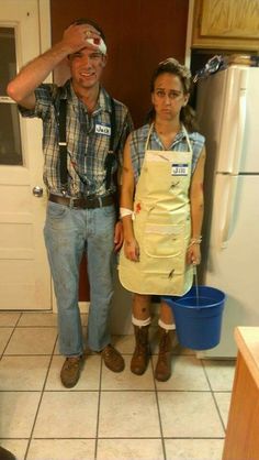 a man standing next to a woman in a kitchen