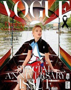 a magazine cover with a woman sitting in a boat