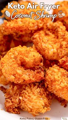 some fried food on a white plate with the words keto air fryer coconut shrimp