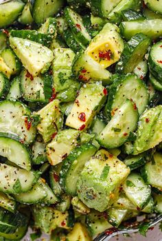 cucumber and pepper salad in a clear bowl