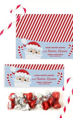 two candy bar wrappers with santa clause on them