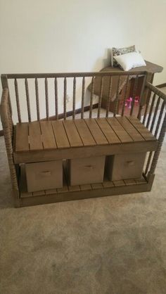 a bench made out of wooden crates in a room with carpeted floor and white walls