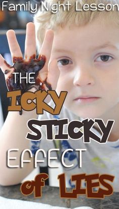 a young boy holding his hand up to the camera with text that reads, the tasty sticky effect of life