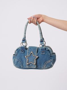 Upgrade your accessory collection and shop this denim shoulder bag in washed light blue, featuring a star magnetic flap and zip-top closure. International shipping available and 15% off for students. Purse Wishlist, Y2k Items, Minga London, Denim Backpack, Denim Bags, Denim Handbags, Denim Purse