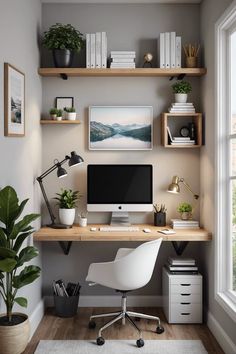 a desk with a computer and some plants on it