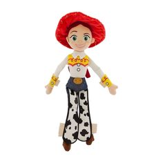 a stuffed toy with a red hair and white shirt on it's head, wearing cowboy