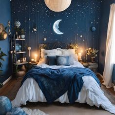 a bedroom decorated in blue and white with stars on the wall, moon lights hanging from the ceiling