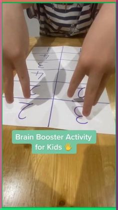 a child's hands are pointing at the letters on a piece of paper that says, brain booster activity for kids