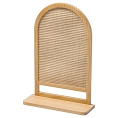 a wooden stand with a woven cover on it's sides and a white background