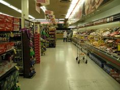 an aisle in a grocery store filled with lots of food