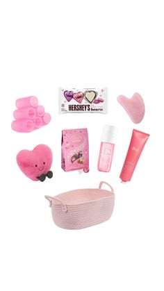 the contents of a pink baby's gift set