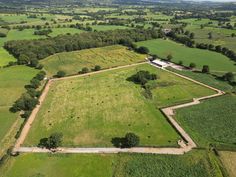 an aerial view of a large field with lots of trees