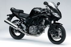 a black motorcycle is shown on a white background