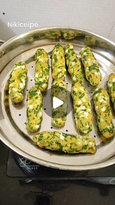 a pan filled with food sitting on top of a stove